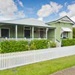 front of house with white fence