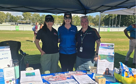 Photo of 3 Legal Aid Queensland staff members at an information stall