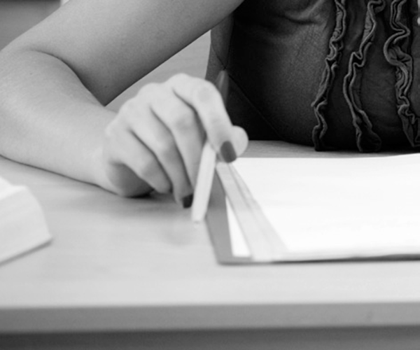 A person looking over a legal document